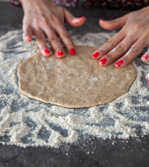 Flattening the dough into a disc and is another unique sensory experience. 