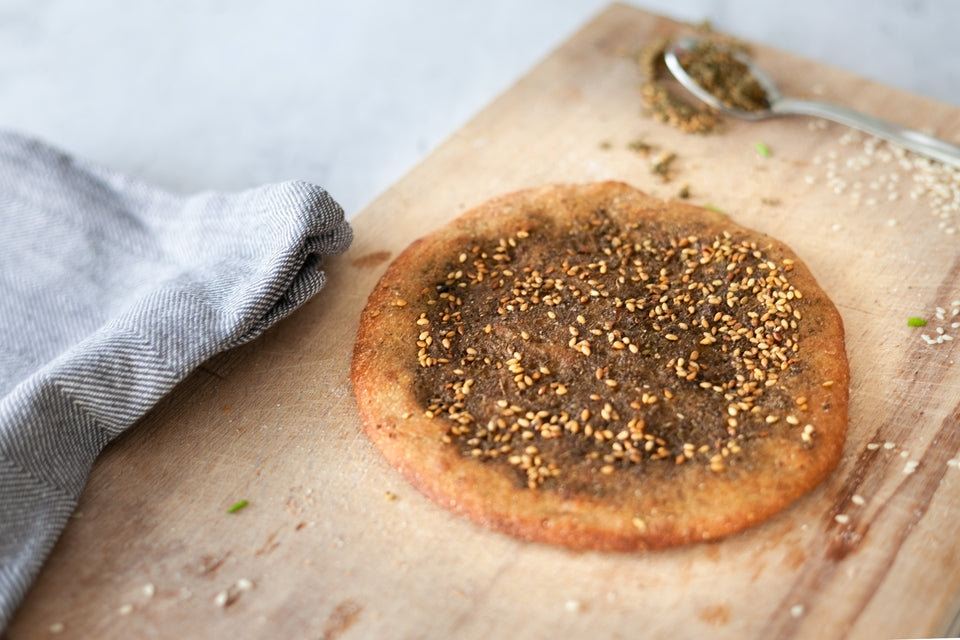 Aromatic Taboon home baked flatbread with Za'atar topping with organic, vegan and Wholemeal ingredients.